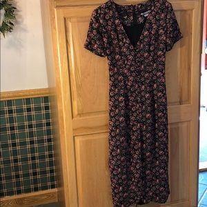 dress has the original shoulder pads! Polyester